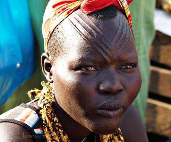 Face carvings on Omo River tribeswoman