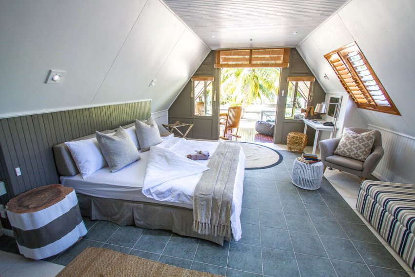 White- and grey-coloured bedroom interiors at Alphonse Island Resort – via AOS Fly Fishing