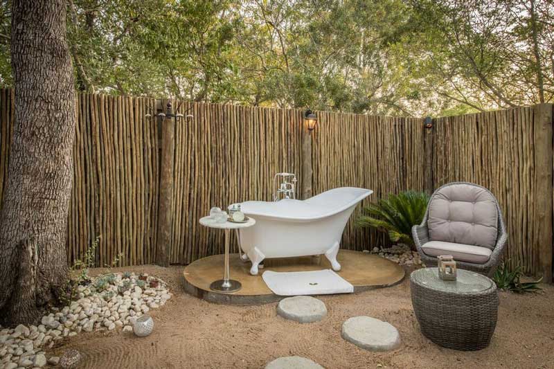 Indulgent outdoor bathroom at Tintswalo Manor House
