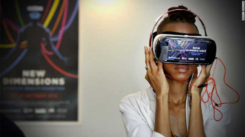 A woman tries a virtual reality headset at the African Futures Exhibition at the Goethe-Institut, Johannesburg.