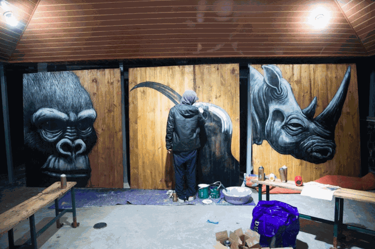 ROA paints at Volcanoes National Park Headquarters | Courtesy of Chris Schwagga / Kurema Kureba Kwiga, via Culture Trip